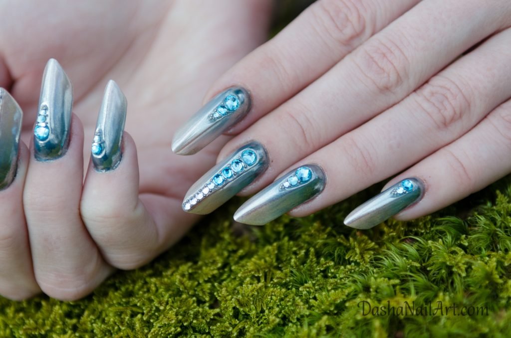 Magic sky blue Edge Nails on moss background