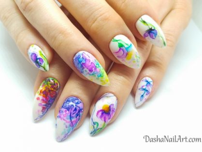 Watercolor nails in rainbow colors with hand drawn flowers